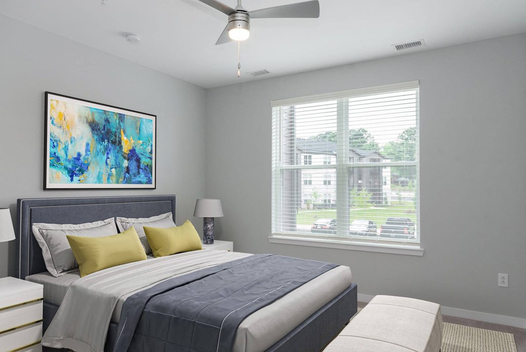 a bedroom with a bed and a window