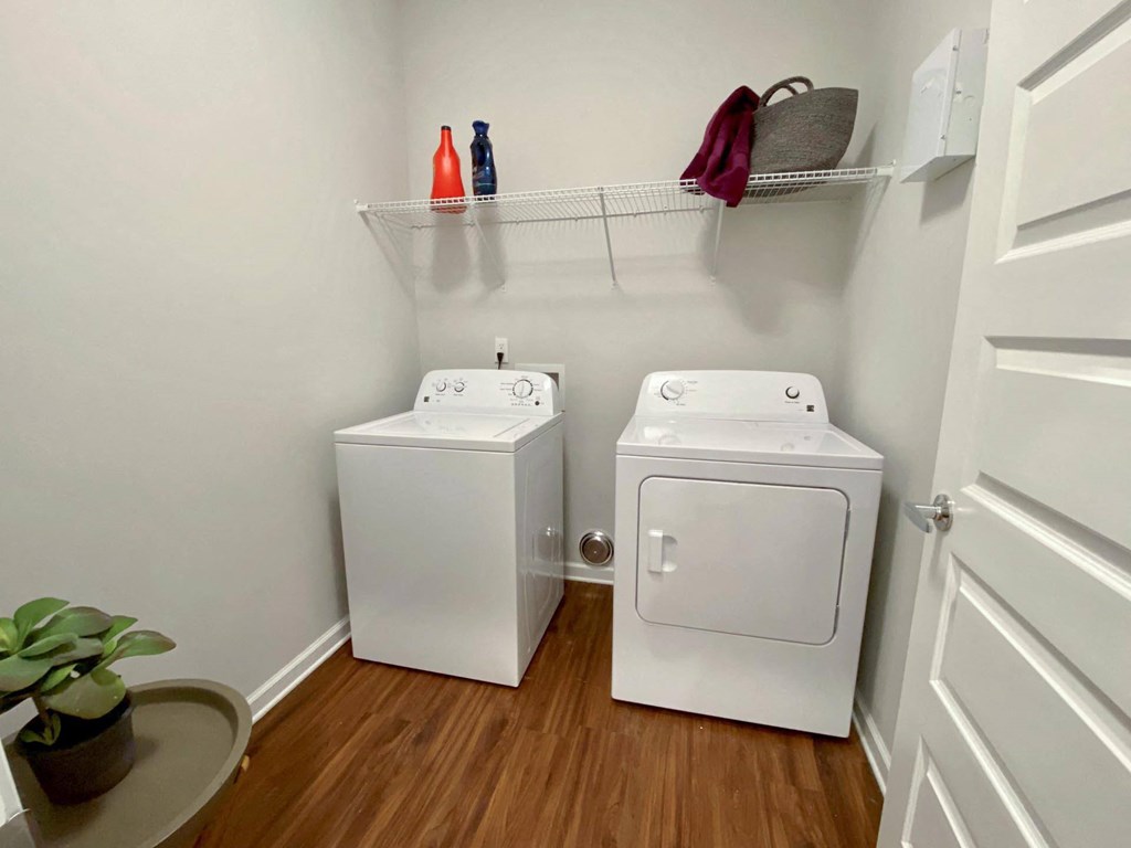 a small laundry room with two washes and a dryer in it