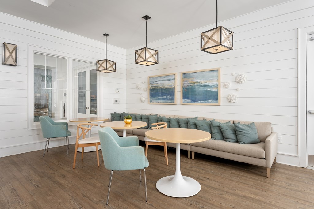 A modern dining room with a wooden table and chairs.