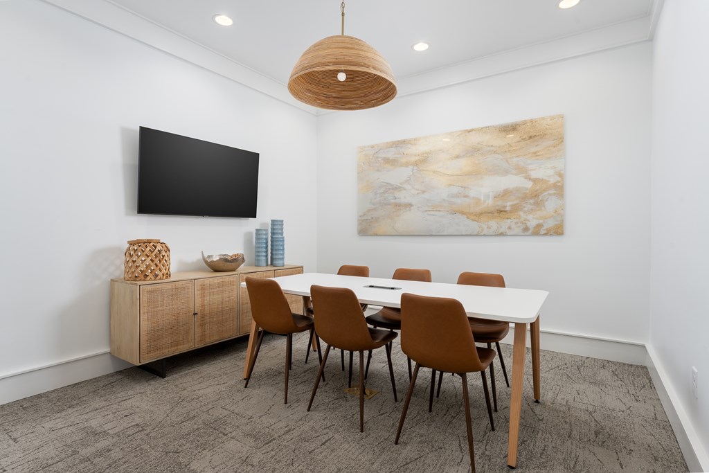 Amenities A modern dining room with a large table and chairs.