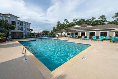 Myrtle Beach SC Apartments for Rent - Lattitude @ The Commons - Sparkling Pool Surrounded by Lounge Seating and a Poolside Cabana