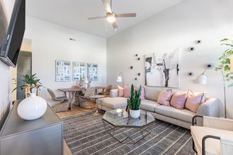 Luxury Townhomes in Wilmington, NC - Myrtle Landing - Living Room with Wood-Style Flooring and a Ceiling Fan