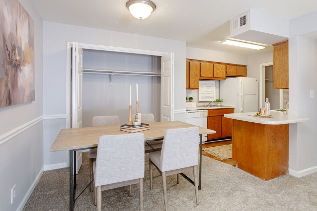 dinign area with closet next to kitchen