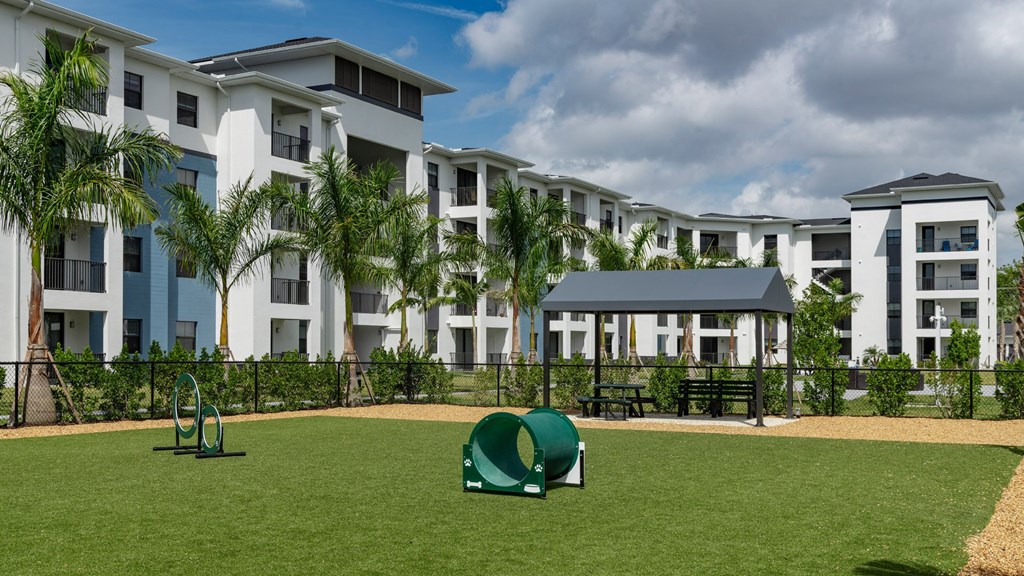 an image of a playground in front of an apartment building