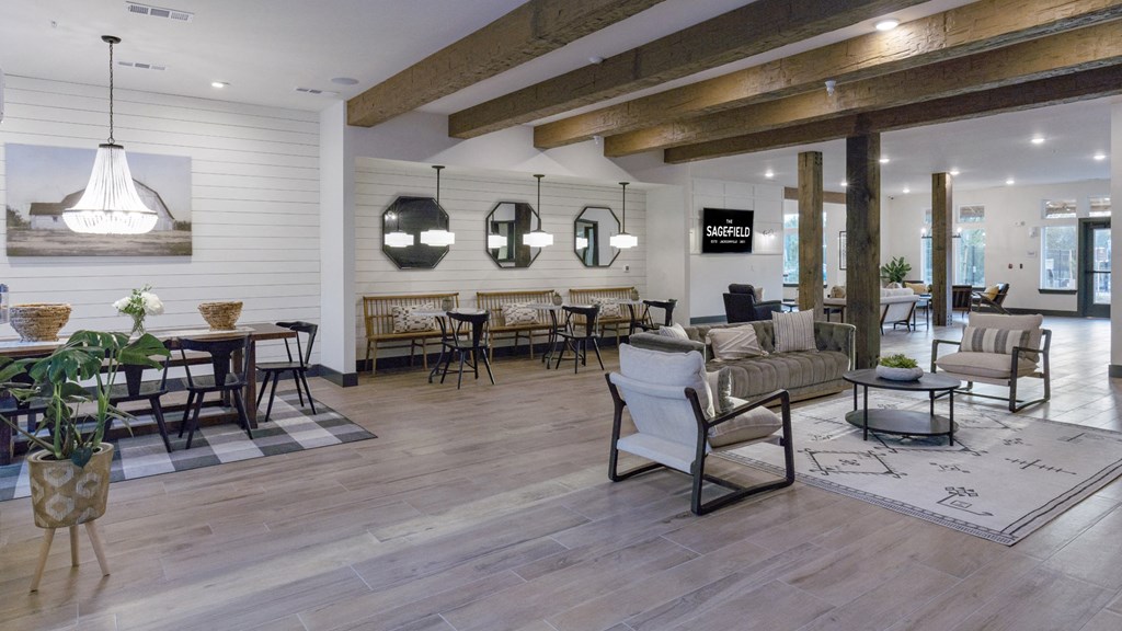 a living room with couches and chairs and a dining room table