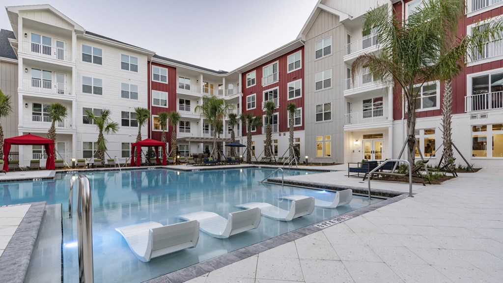 a swimming pool in the middle of an apartment building