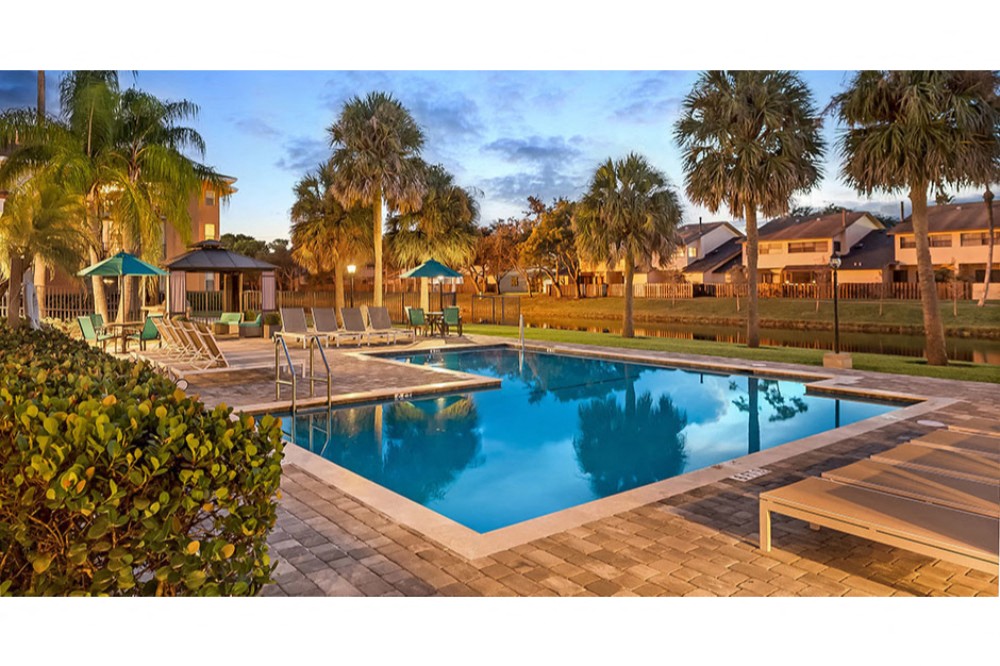 Sparkling swimming pool at Midora at Woodmont in Tamarac, FL