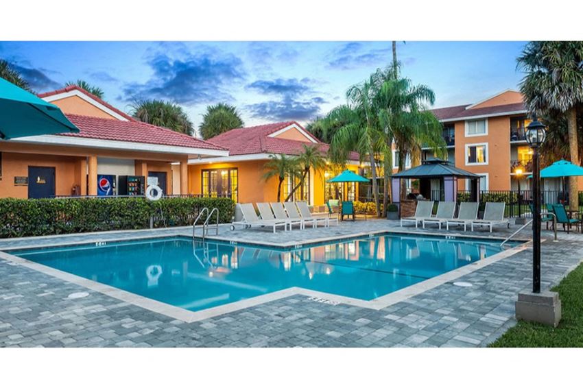 Sparkling swimming pool at Midora at Woodmont in Tamarac, FL - Photo Gallery 1