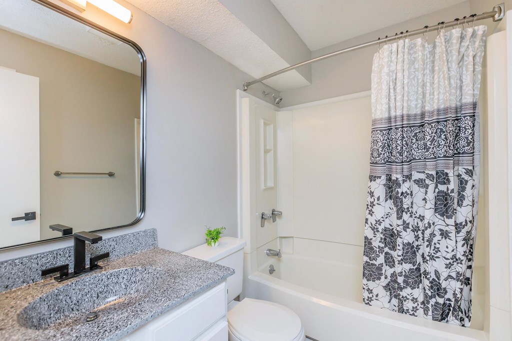 large bathroom with shower and tub combo