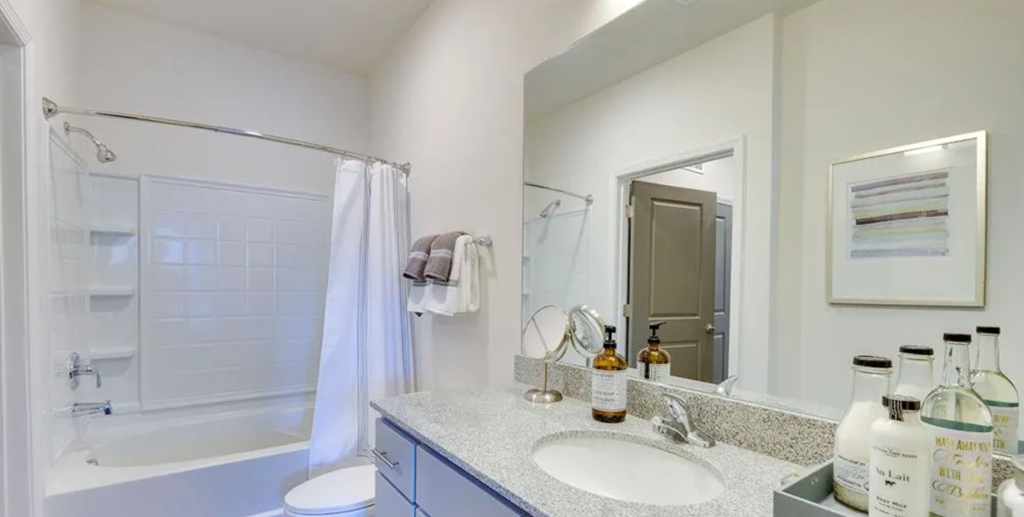 a bathroom with a bathtub and a sink