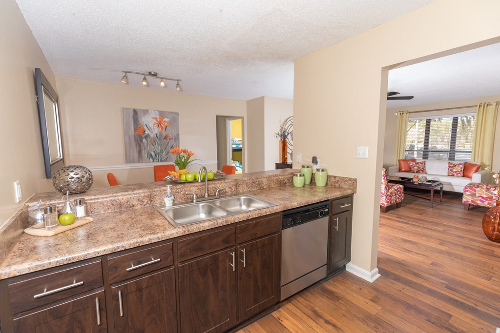 a kitchen with stainless steel appliances and granite counter tops