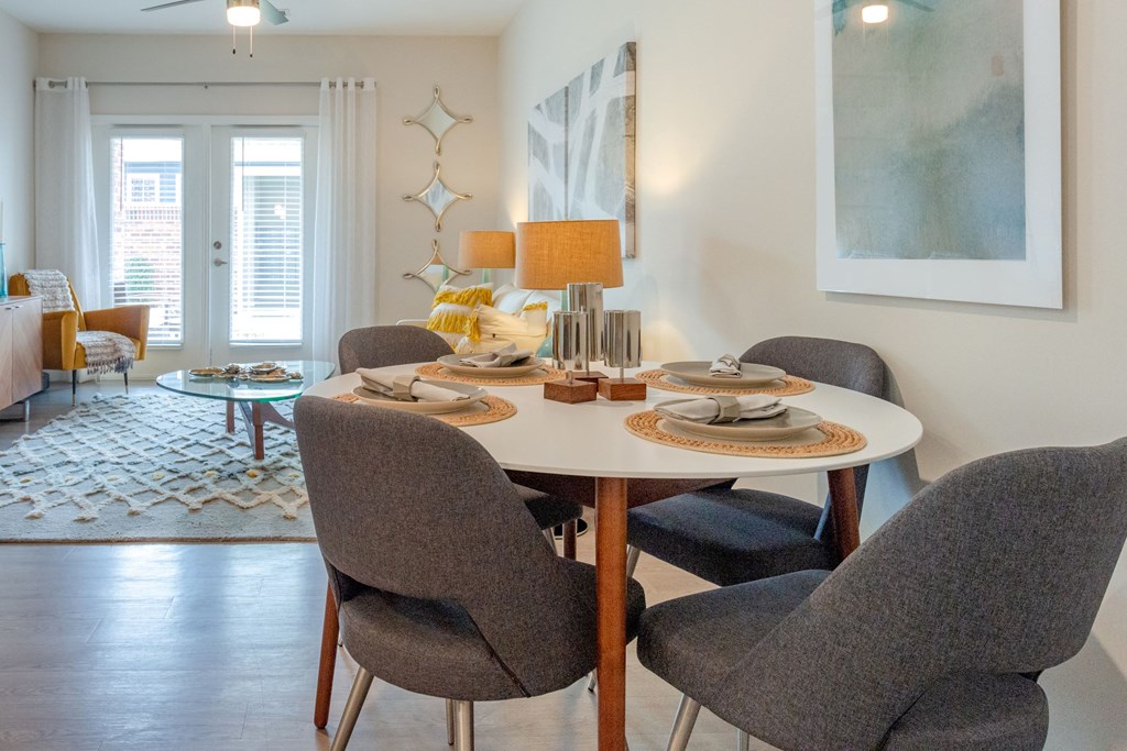 Home Interior a dining room with a table and chairs