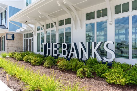 A sign that says "The Banks" in front of a building.