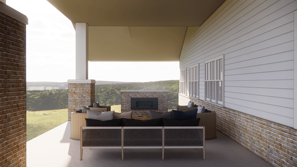 a living room with a couch and a fireplace on a covered patio