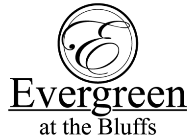The image features the text "Evergreen at the Bluffs" with a decorative swirl design above the text.