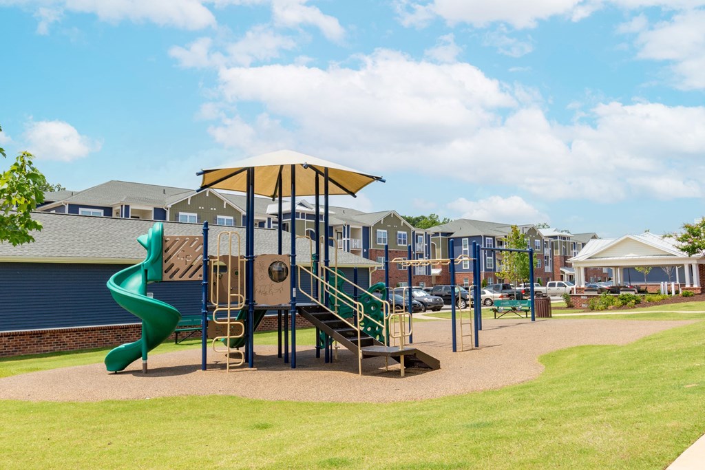 a playground with a slide and a spiral slide