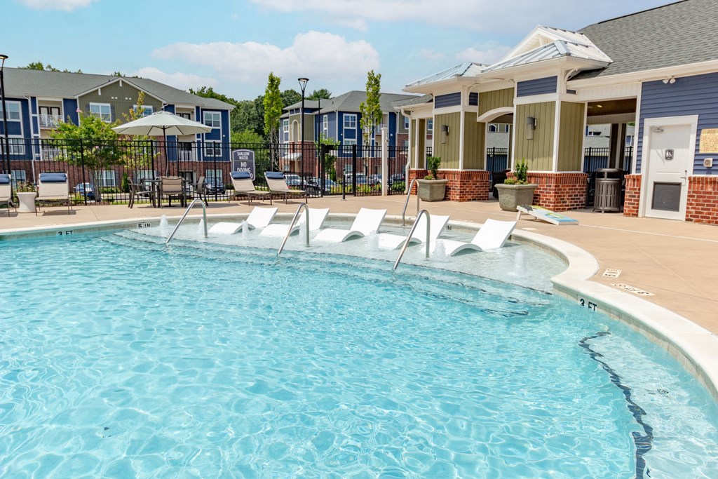 our apartments offer a swimming pool with chaise lounge chairs