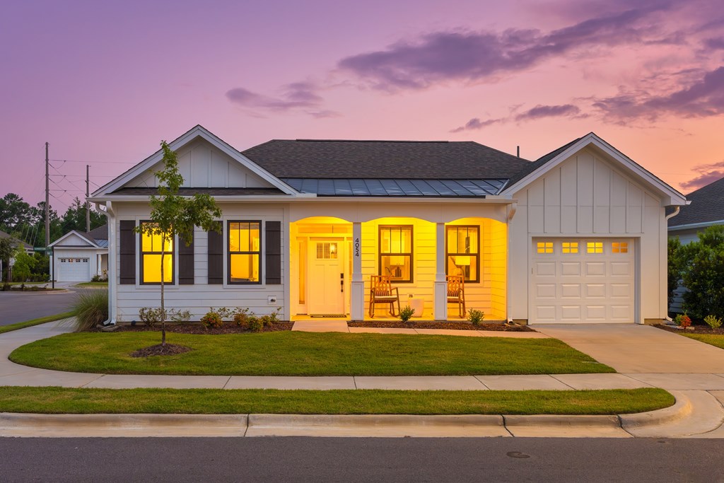 A house with a front yard and a driveway.