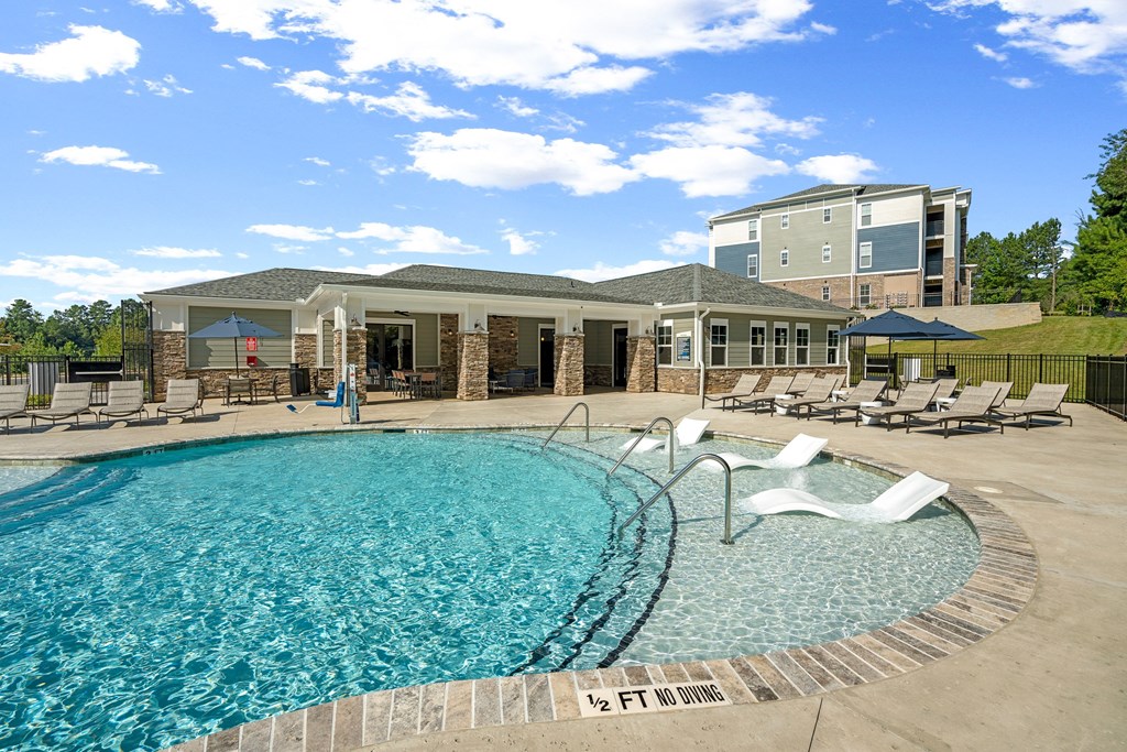 Amenities Highlight Resort-Style Saltwater Swimming Pool with Sun Shelf and Inset Seating