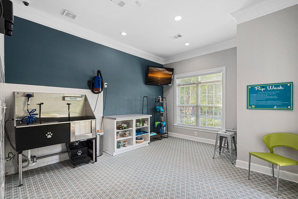 a game room with a foosball table and a tv