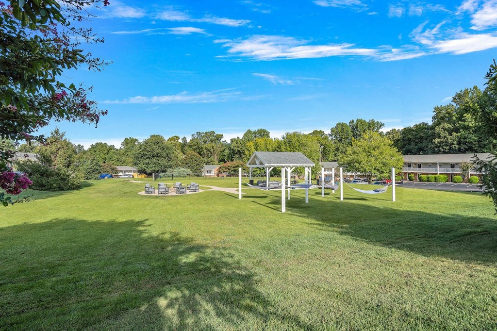 a park with a playground and a swing set
