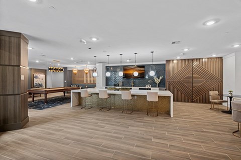 A modern dining room with a wooden table and chairs.