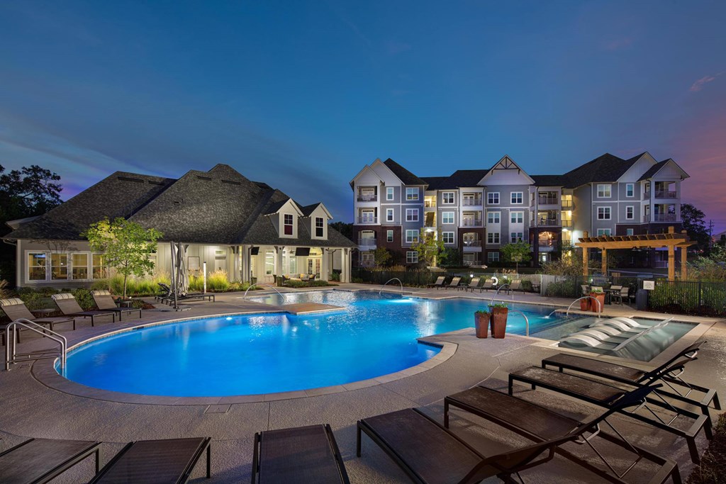 A large house with a pool in the backyard.