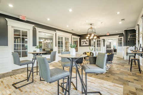 A dining area with a table and chairs.