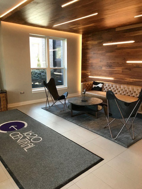 A room with a rug that says "Central" on it.