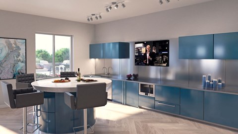 A modern kitchen with a round table and chairs.