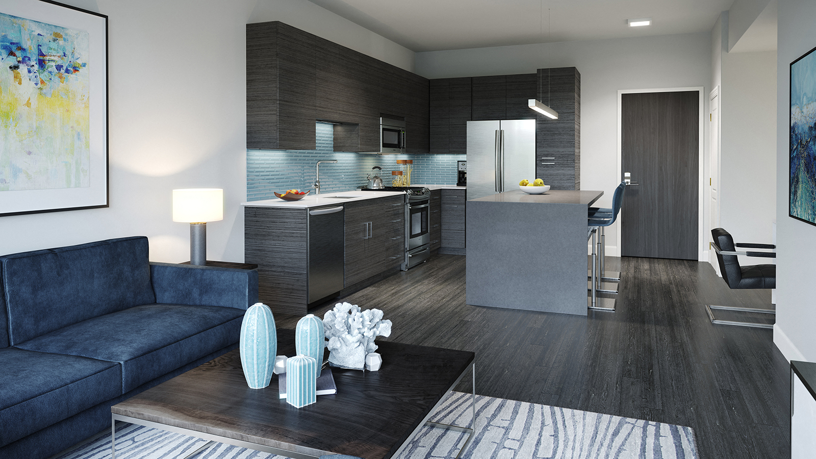 A modern living room with a dark blue sofa and a coffee table with decorative objects on it.