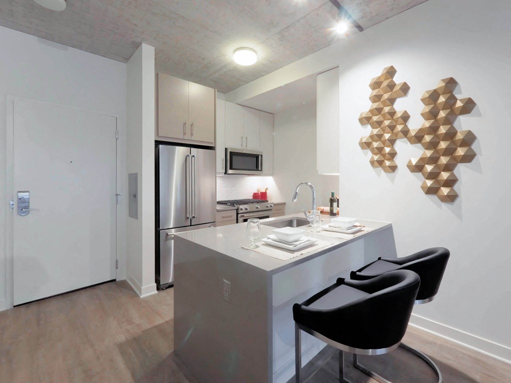 1 bedroom apartments have kitchens with a bar