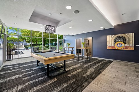 a rec room with a pool table and a mural on the wall at Halsted Flats Apartments, Chicago, IL, 60613