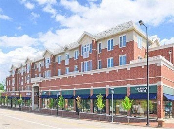 a large brick building on the side of a street