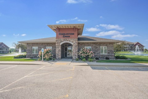 A building with a sign that says "Croplettone Creek" in front of it.