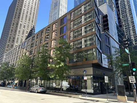 a building on the corner of a street with a traffic light