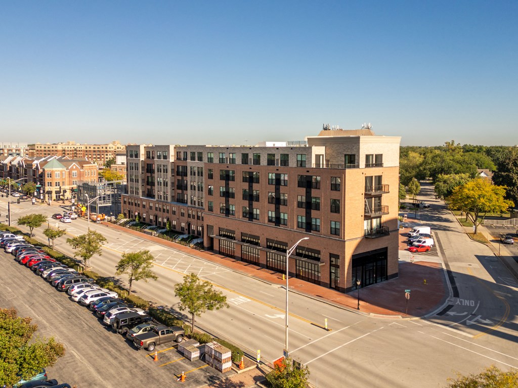 an aerial view of a building on a city street