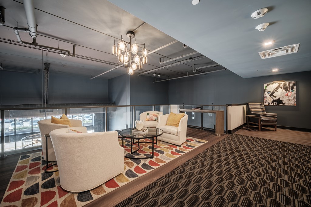 a living room with couches and chairs and a table