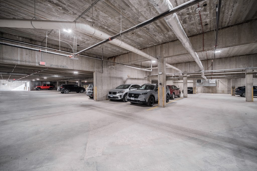 a parking garage with cars parked in it