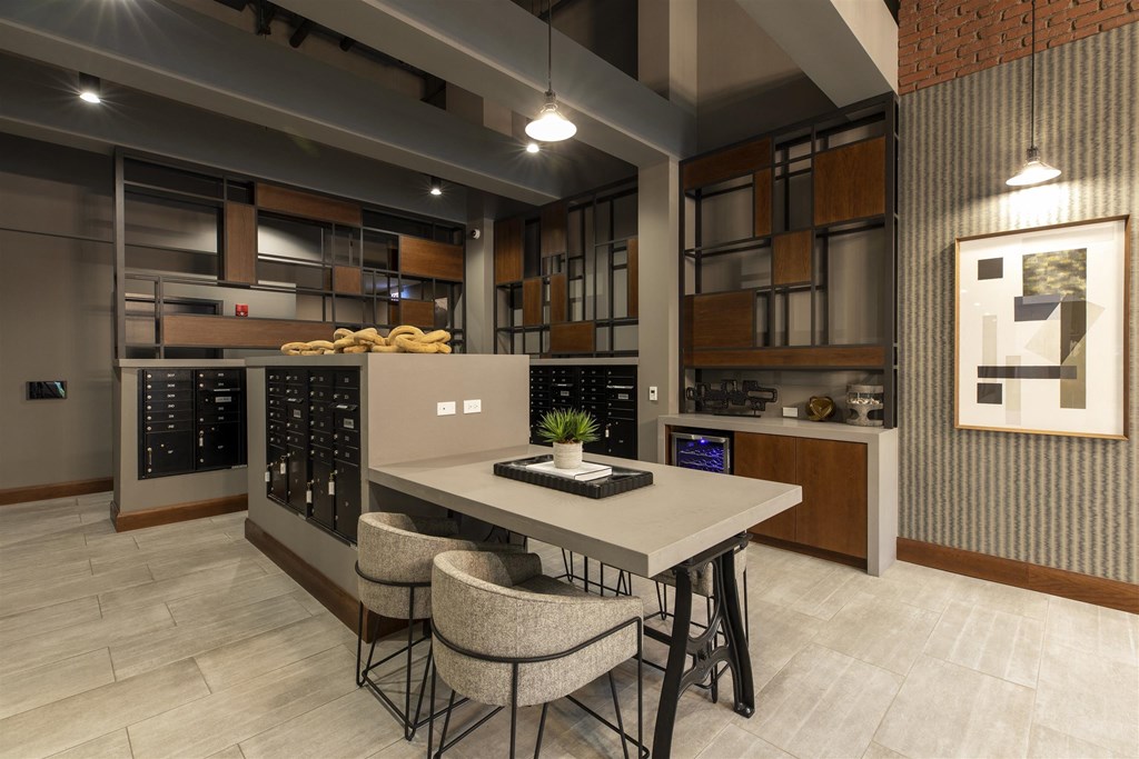 A modern kitchen with a table and chairs in the foreground.