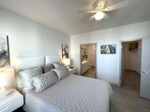 a bedroom with a large bed and a ceiling fan at 42 Hundred On The Lake, St Francis
