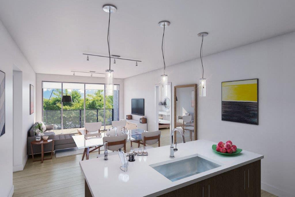 A modern kitchen with a large island and a view of the outdoors.