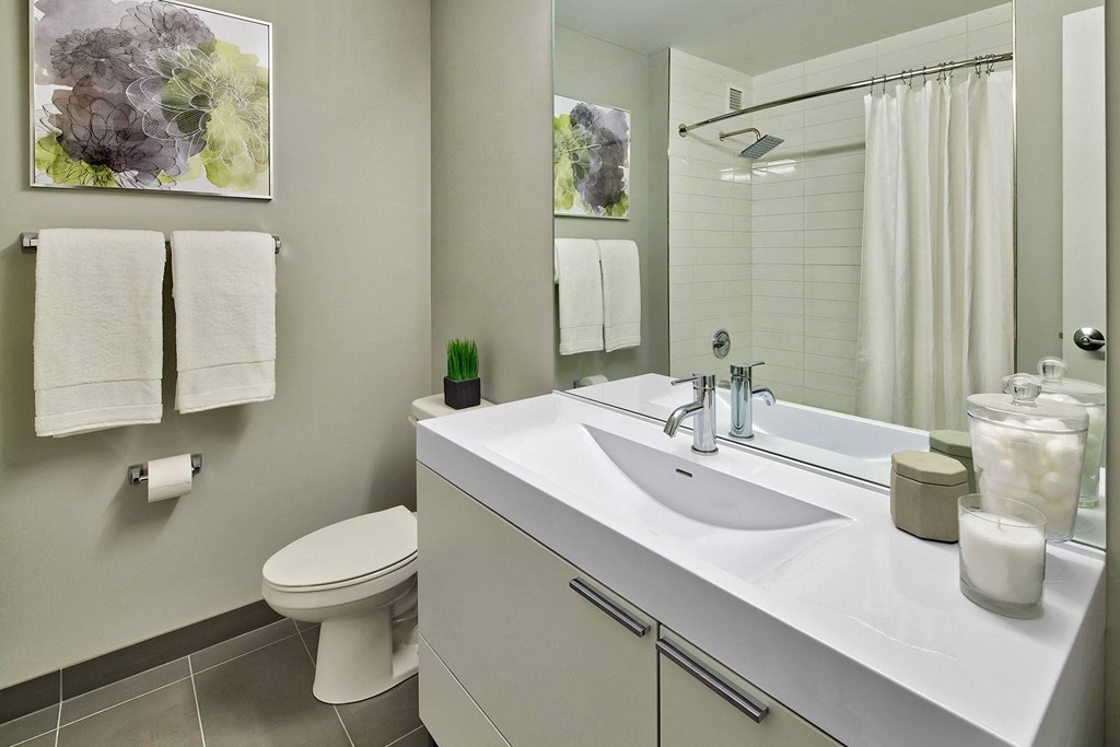 a bathroom with a sink and a toilet  at The Kent, Illinois