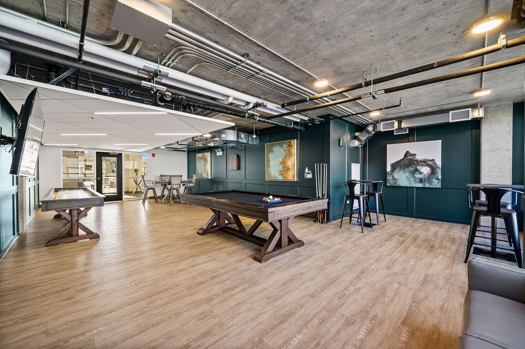 a game room with a ping pong table and a foosball table at Lakeview 3200 Apartments, Illinois