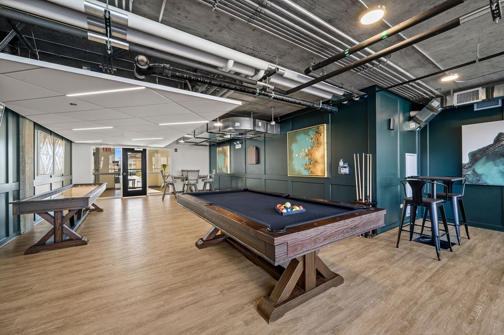 a game room with a pool table and ping pong table a game room with a pool table and ping pong table at Lakeview 3200 Apartments, Chicago, Illinois