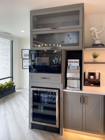 a kitchen with a cabinet with a refrigerator and a microwave at Enclave Crystal Lake Townhomes and Apartments, Illinois, 60014