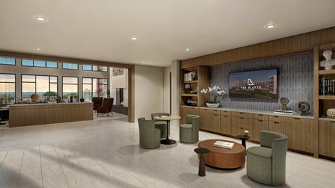 A spacious waiting room with a large window, a reception desk, and comfortable seating.