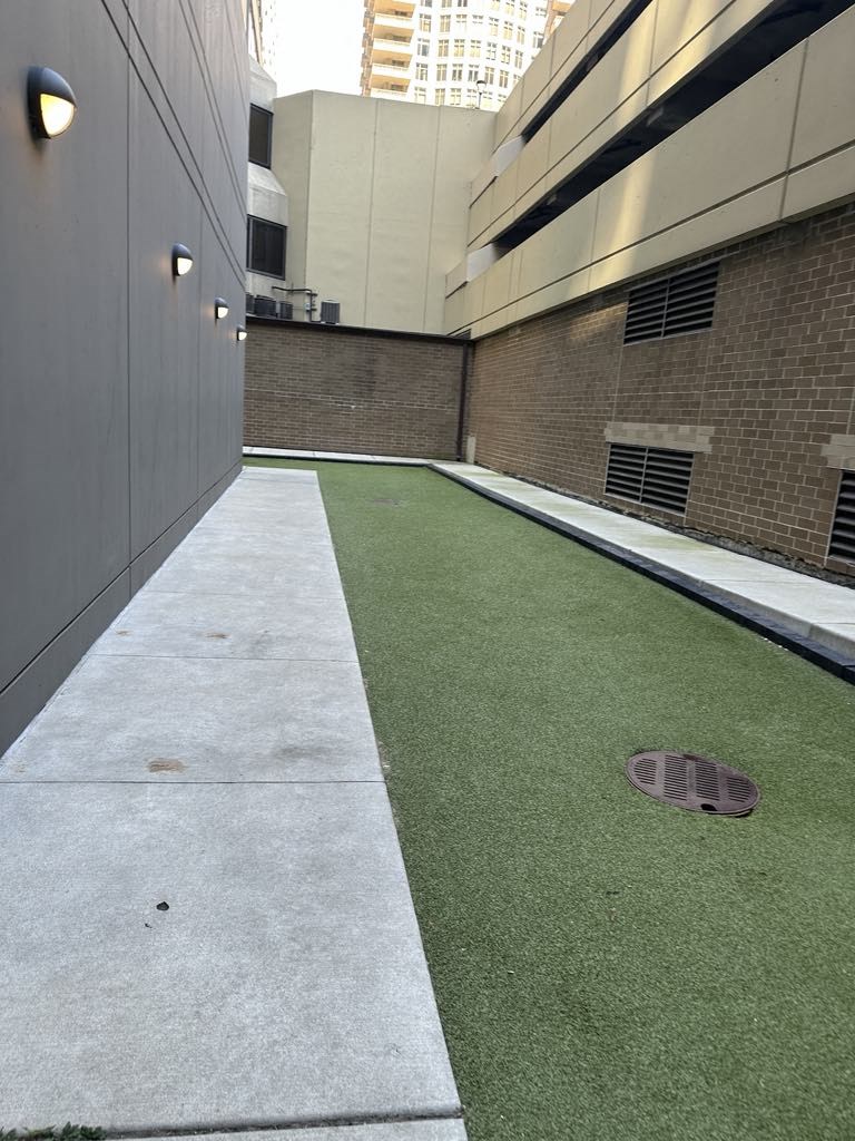 an artificial lawn on the side of a building