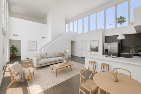 A modern living room with a white couch and wooden furniture.