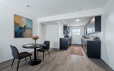 The Canvas one and two bedroom apartments Nashville dining room with a round table and chairs.